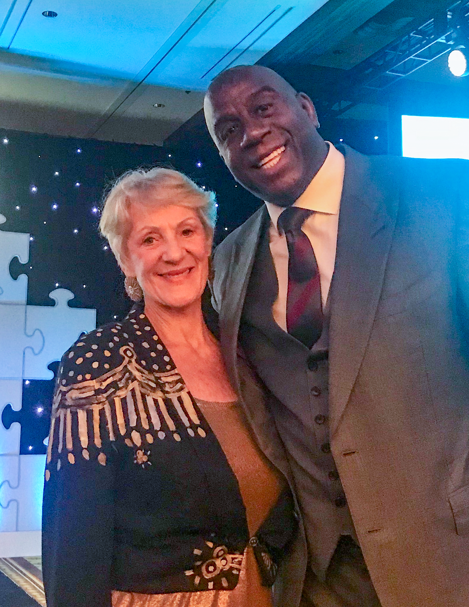 Mary Lou Dobbs with Magic Johnson at Pacific Life Insurance Educational Symposium