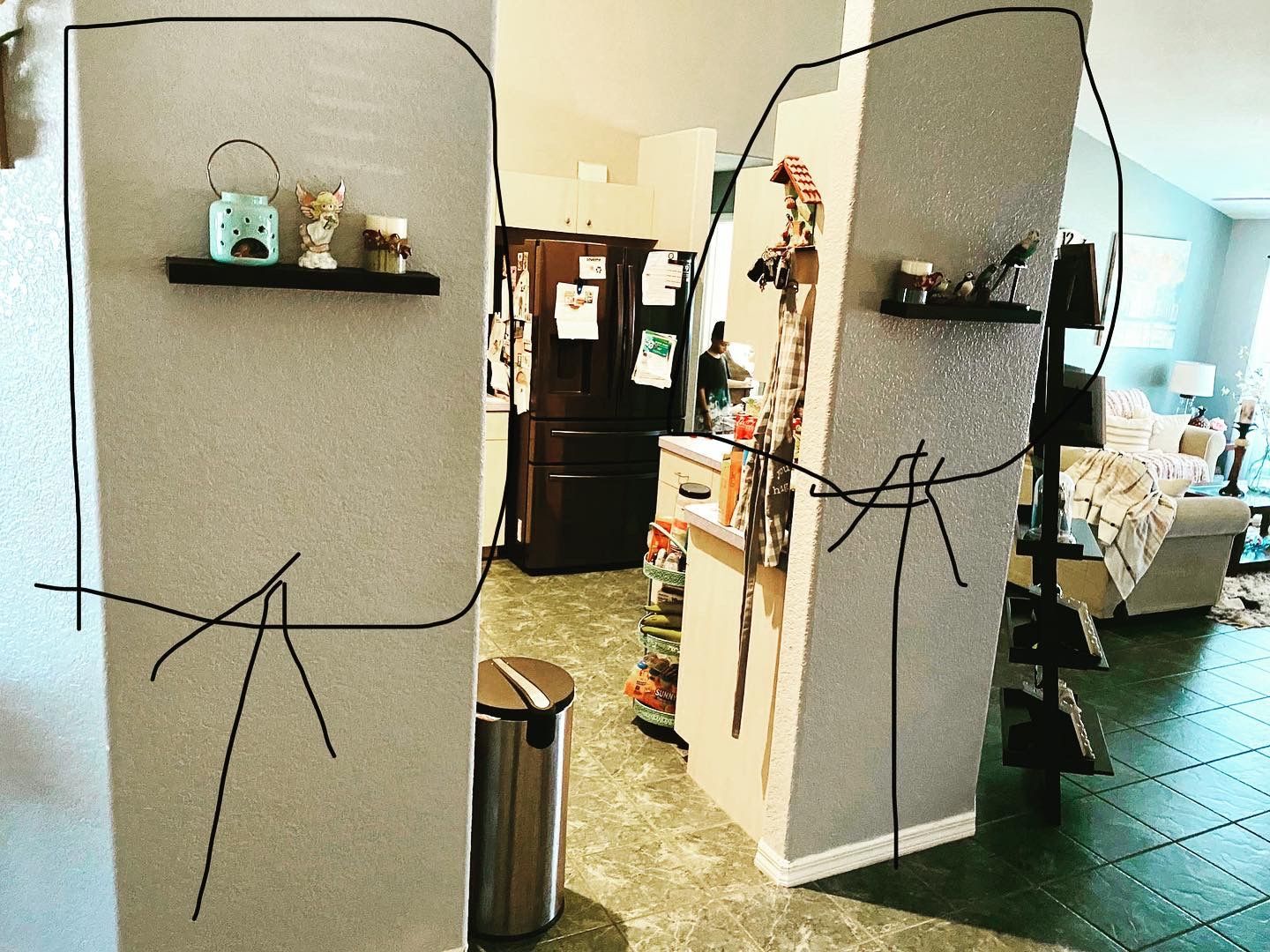 A drawing of a person on a wall in a living room