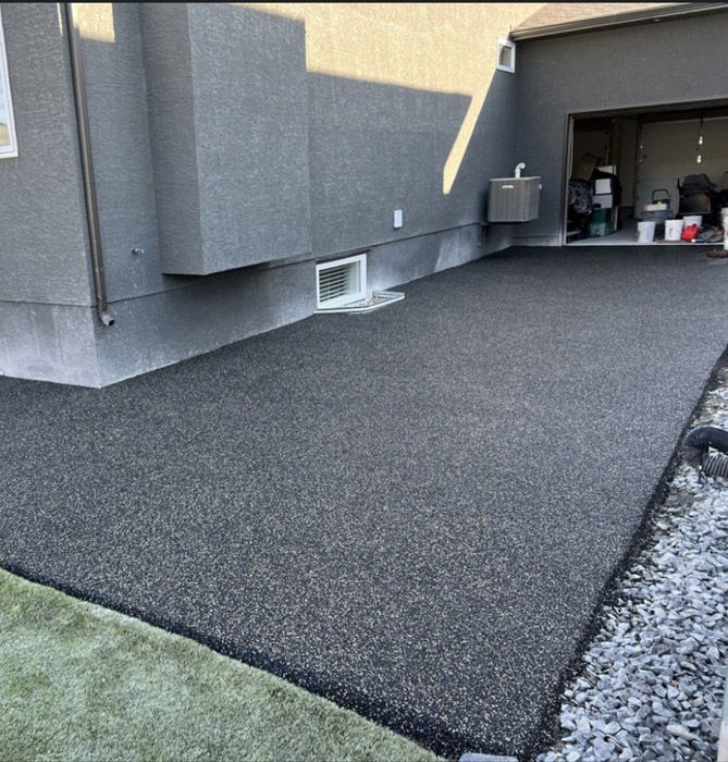 A driveway is being installed in front of a house