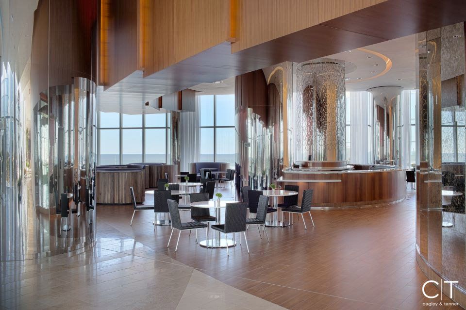 A large room with tables and chairs and a sign that says ct