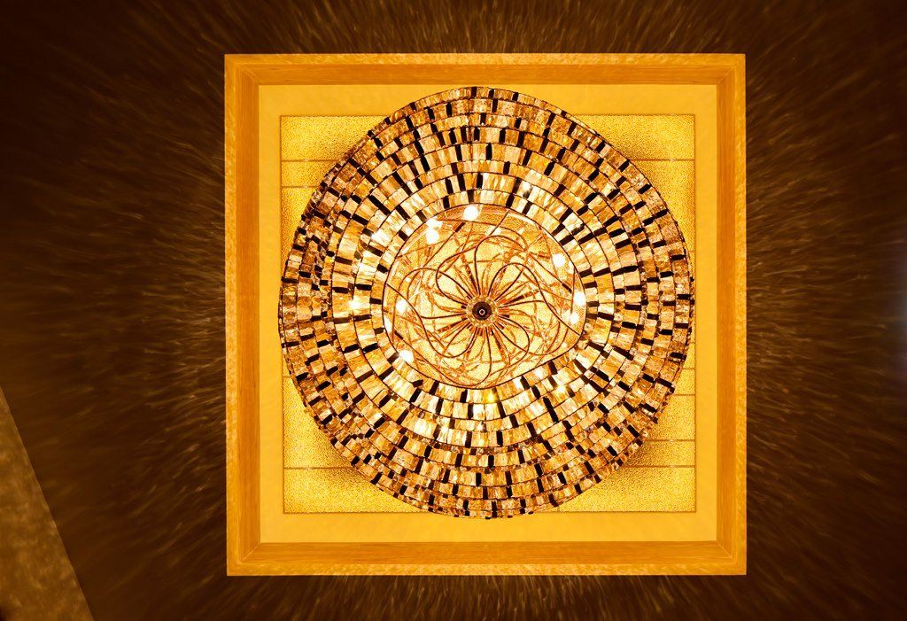 A large chandelier is hanging from the ceiling of a building.