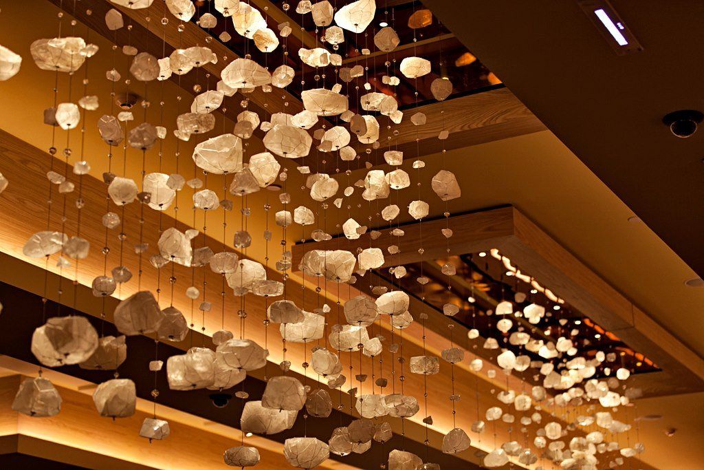 A ceiling with a lot of lights hanging from it