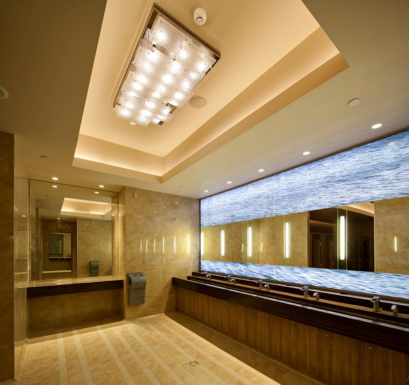 A bathroom with two sinks and a large mirror