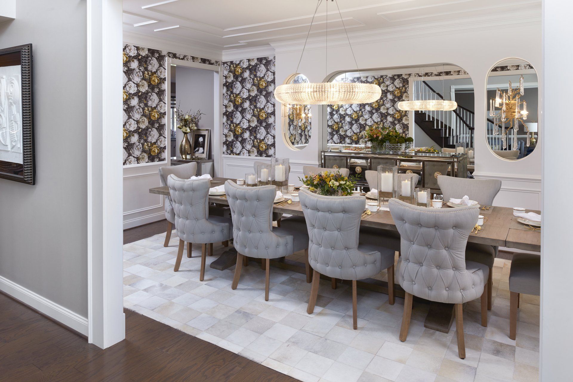 A dining room with a long table and chairs