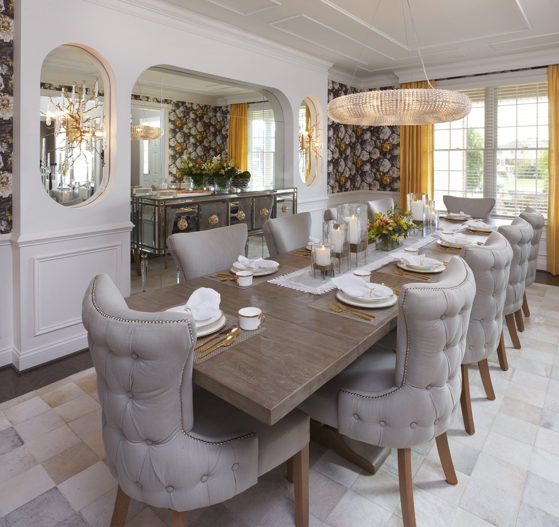 A dining room with a long table and chairs