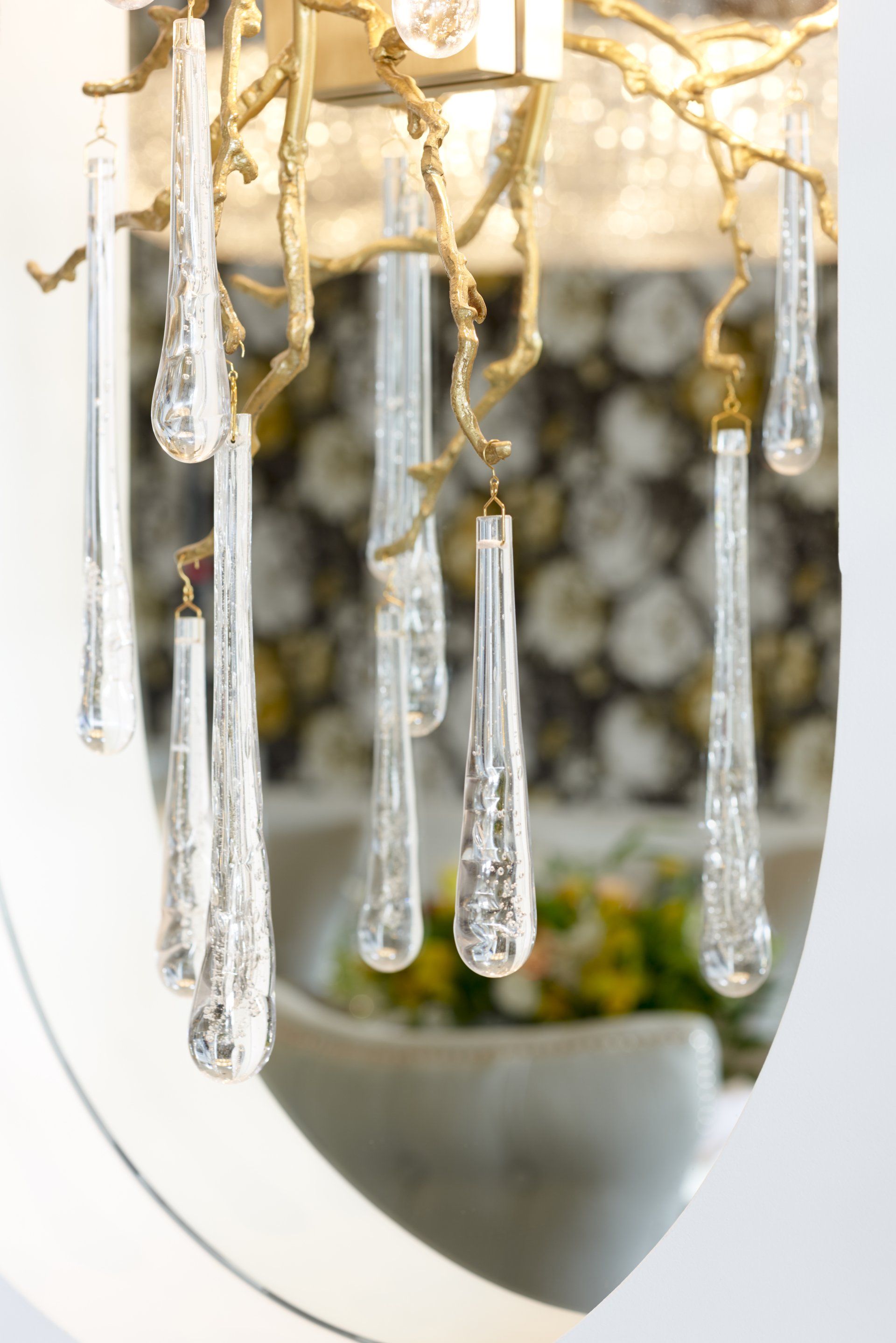 A close up of a chandelier with crystals hanging from it.