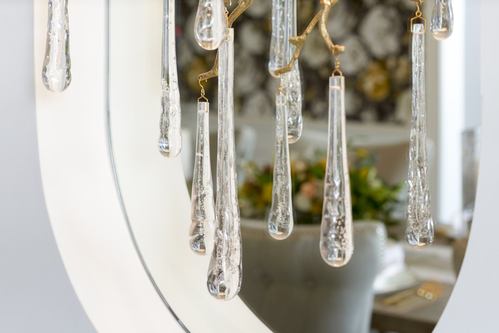 A close up of a chandelier with crystals hanging from it.