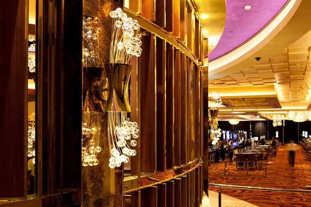 A large room with a purple ceiling and lots of lights