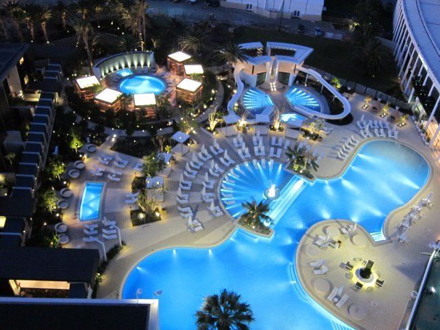 An aerial view of a large swimming pool at night