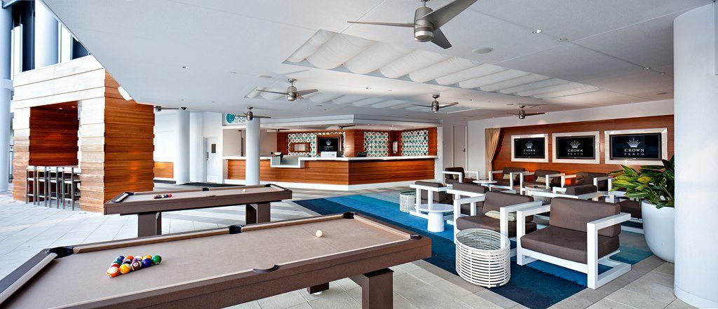 There is a pool table in the middle of the room.