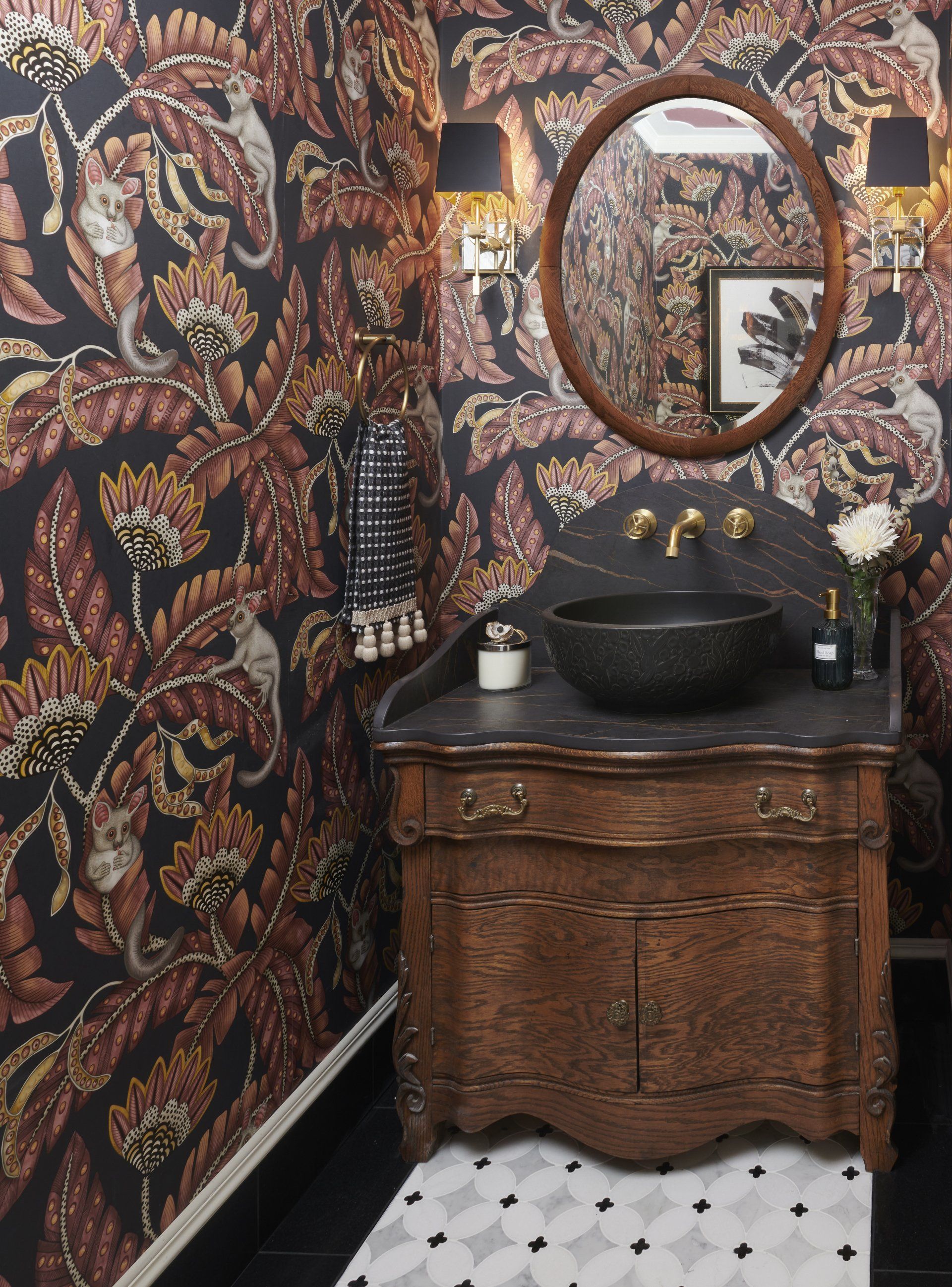 A bathroom with a sink and a mirror on the wall