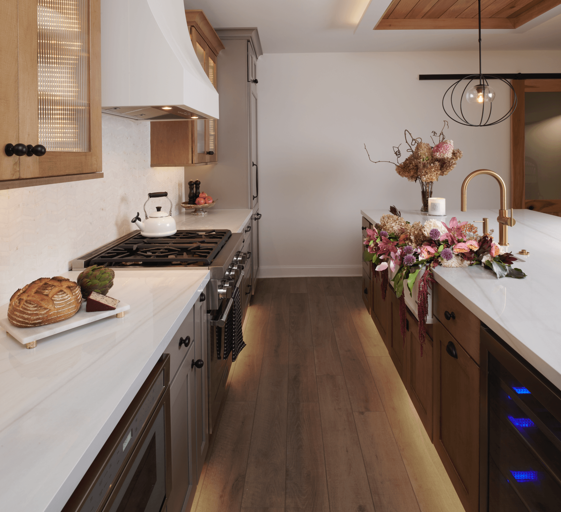 A kitchen with wooden cabinets and white counter tops