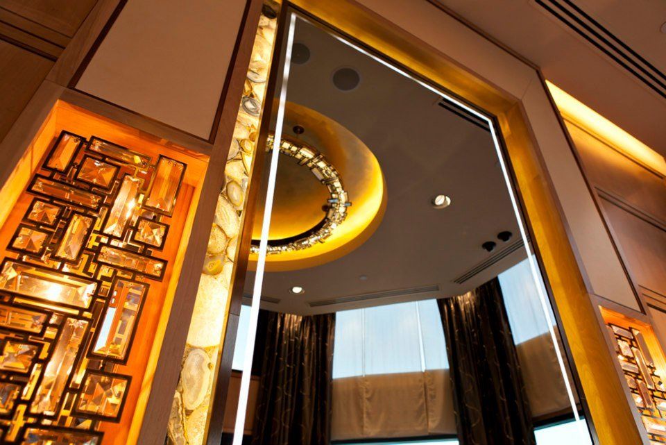 A room with a large chandelier hanging from the ceiling