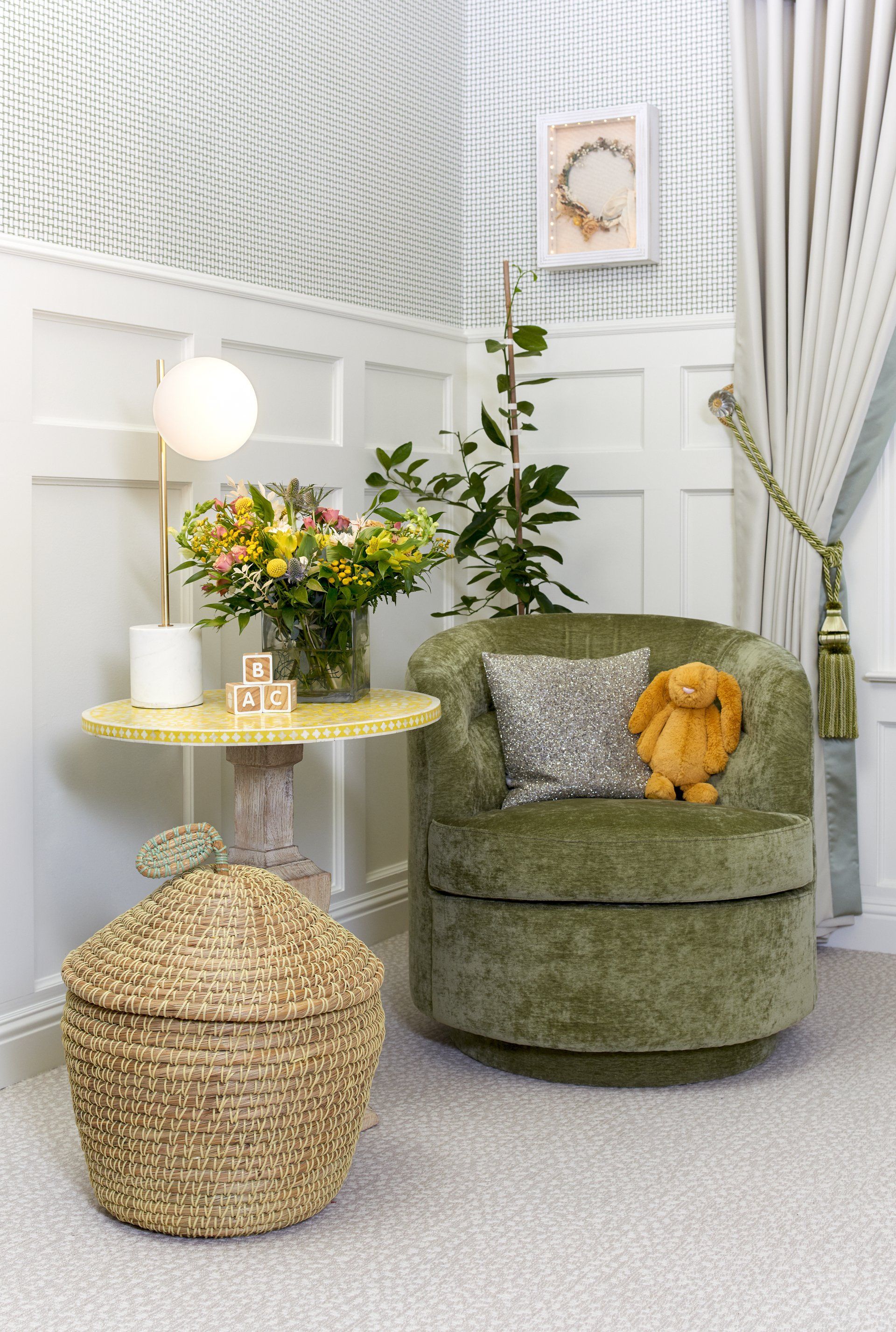 There is a chair with a teddy bear on it in the room.