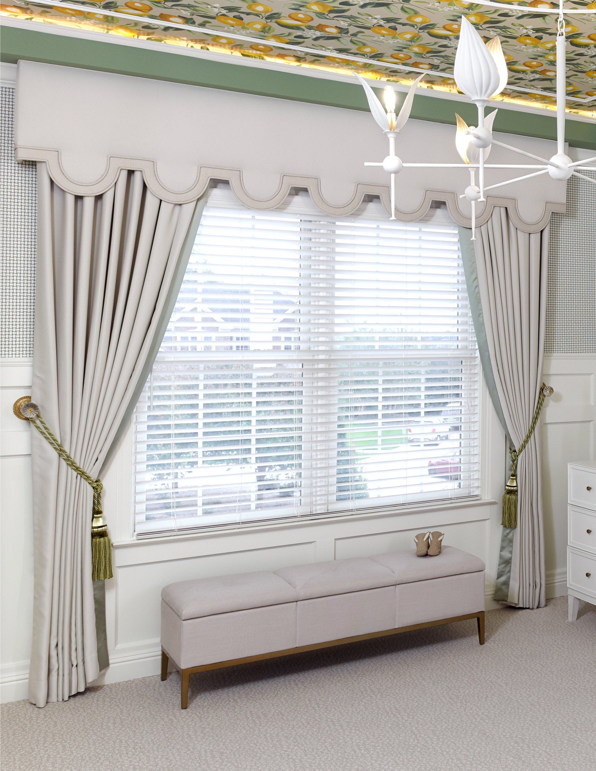 There is a bench in front of a window in a room.