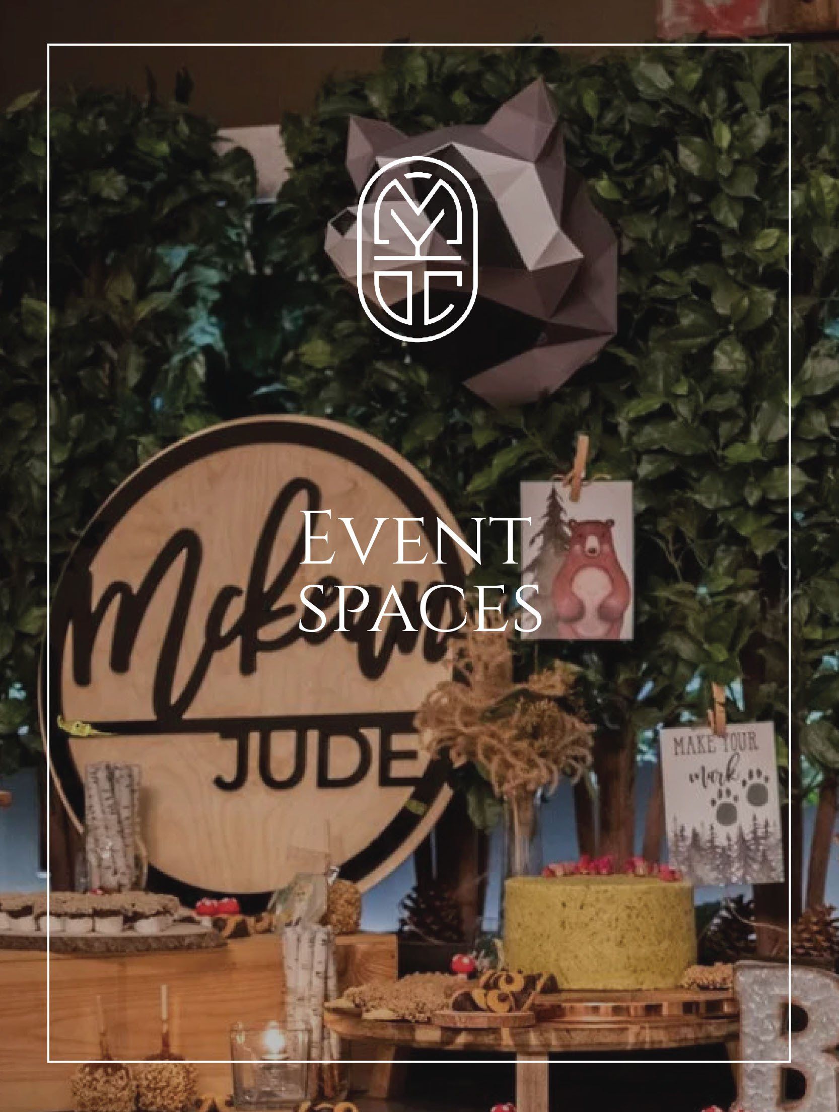 A table with a cake on it and a sign that says `` event spaces jude ''.
