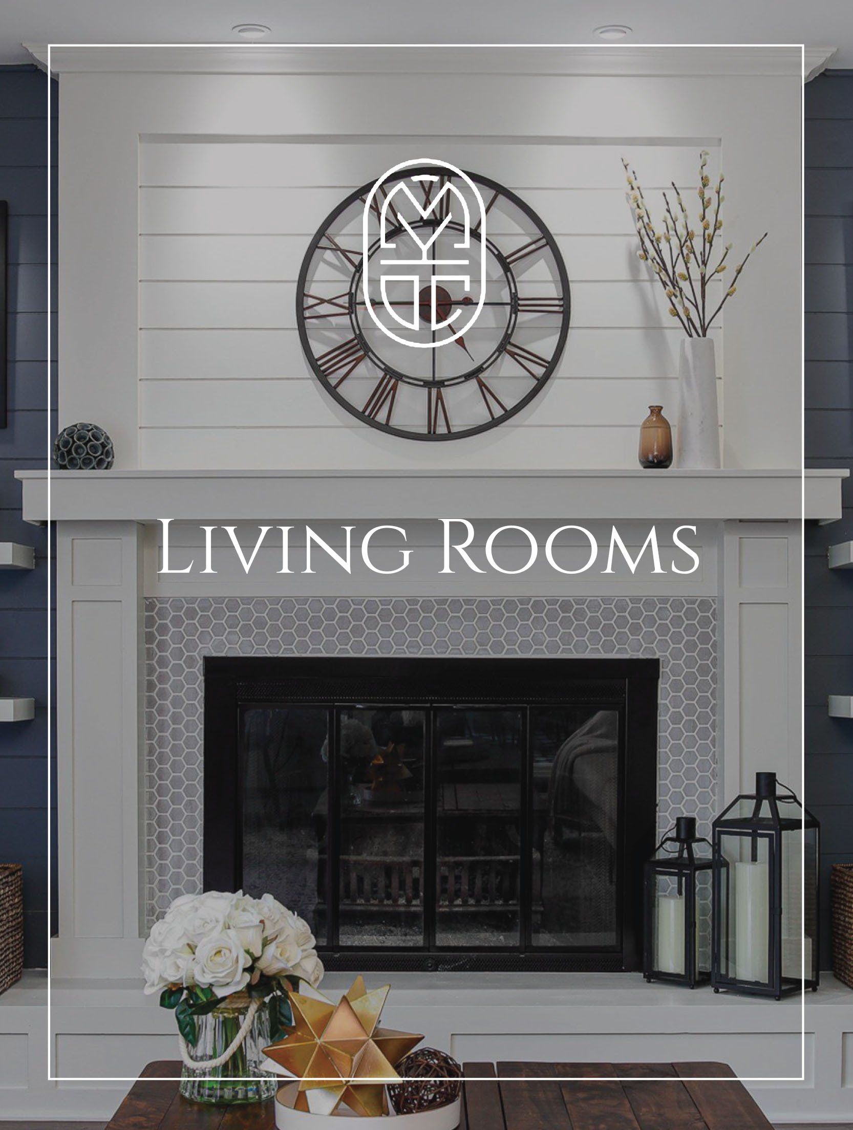 A living room with a fireplace and a clock on the wall.