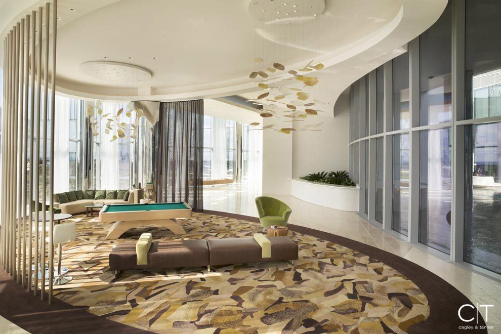 There is a pool table in the middle of the room.