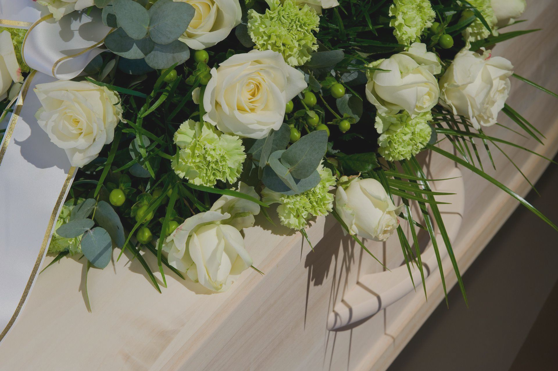 A family is sitting on a dock fishing.