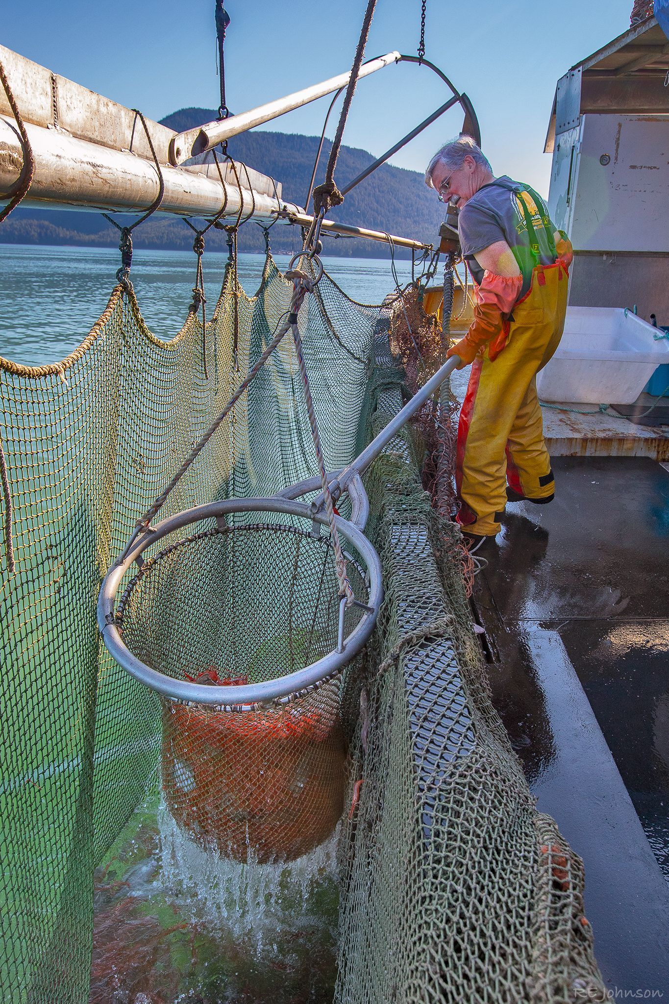 Bill Armstrong, Sea to Shore Seafood fisherman, uses a net on his fishing vessel to bring in a haul of sustainable seafood