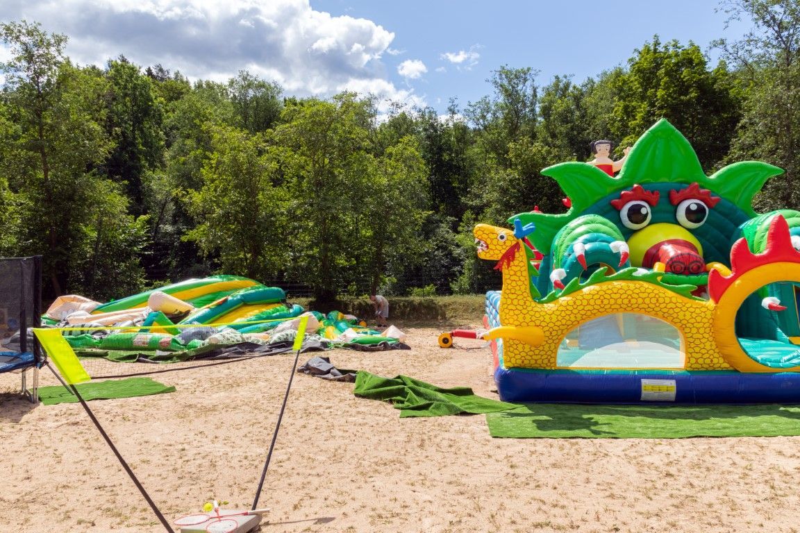 Bounce house and water slide, promising endless fun for kids.