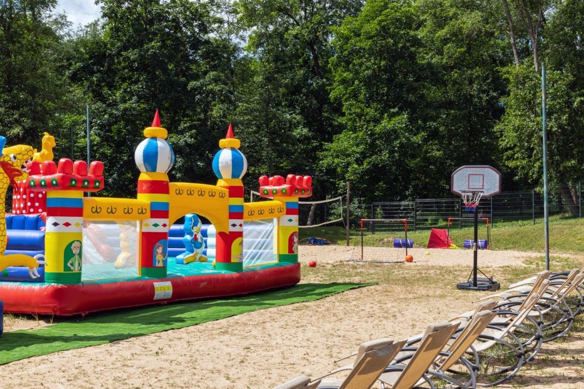 Large, colorful bounce house, ready for hours of kids' bouncing fun.
