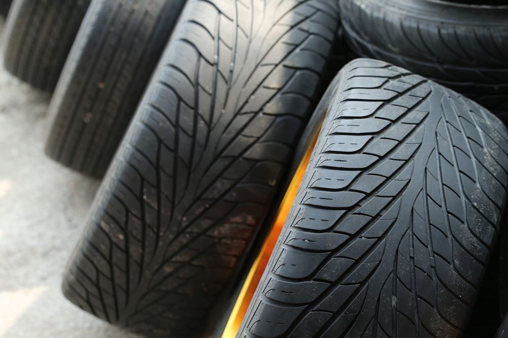 A Bunch of Tires Are Stacked on Top of Each Other