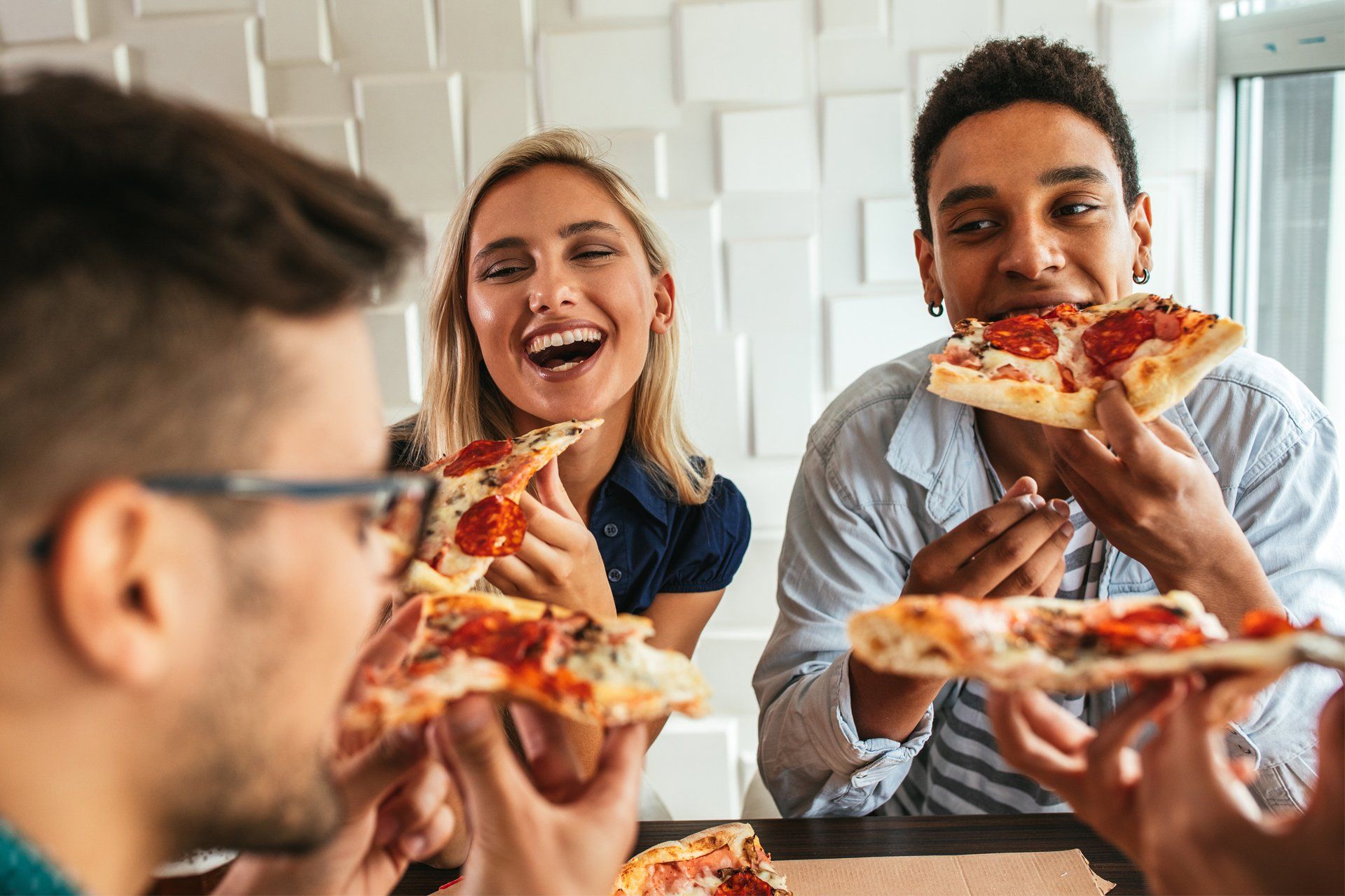 Group of Friends Eating Pizza