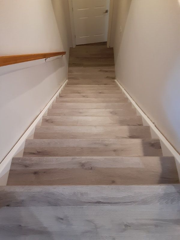A set of stairs leading up to the second floor of a house.