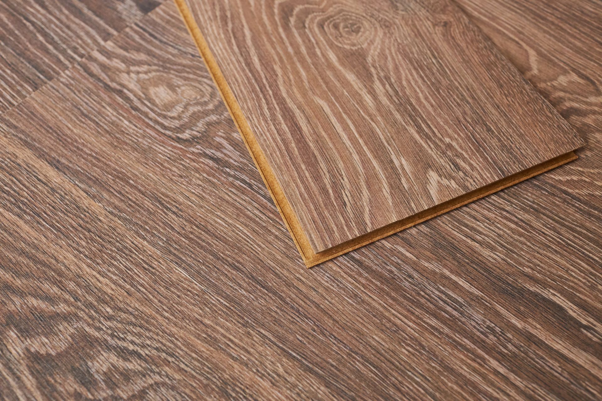 A close up of a piece of wood on a wooden floor.