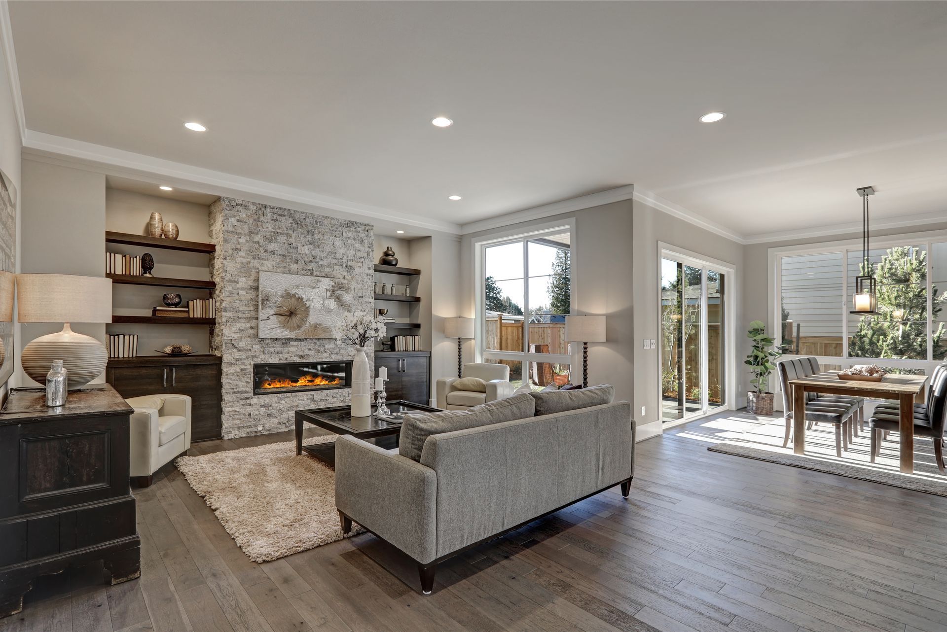 A living room filled with furniture and a fireplace.