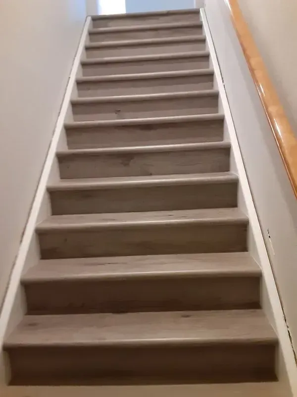 A set of stairs leading up to a second floor in a house.