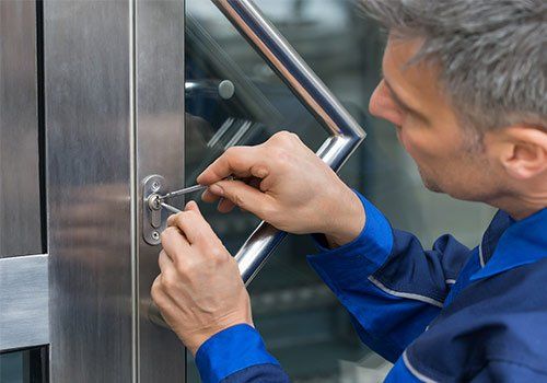 Installation — A Man Installing A Door Lock in Boston, MA