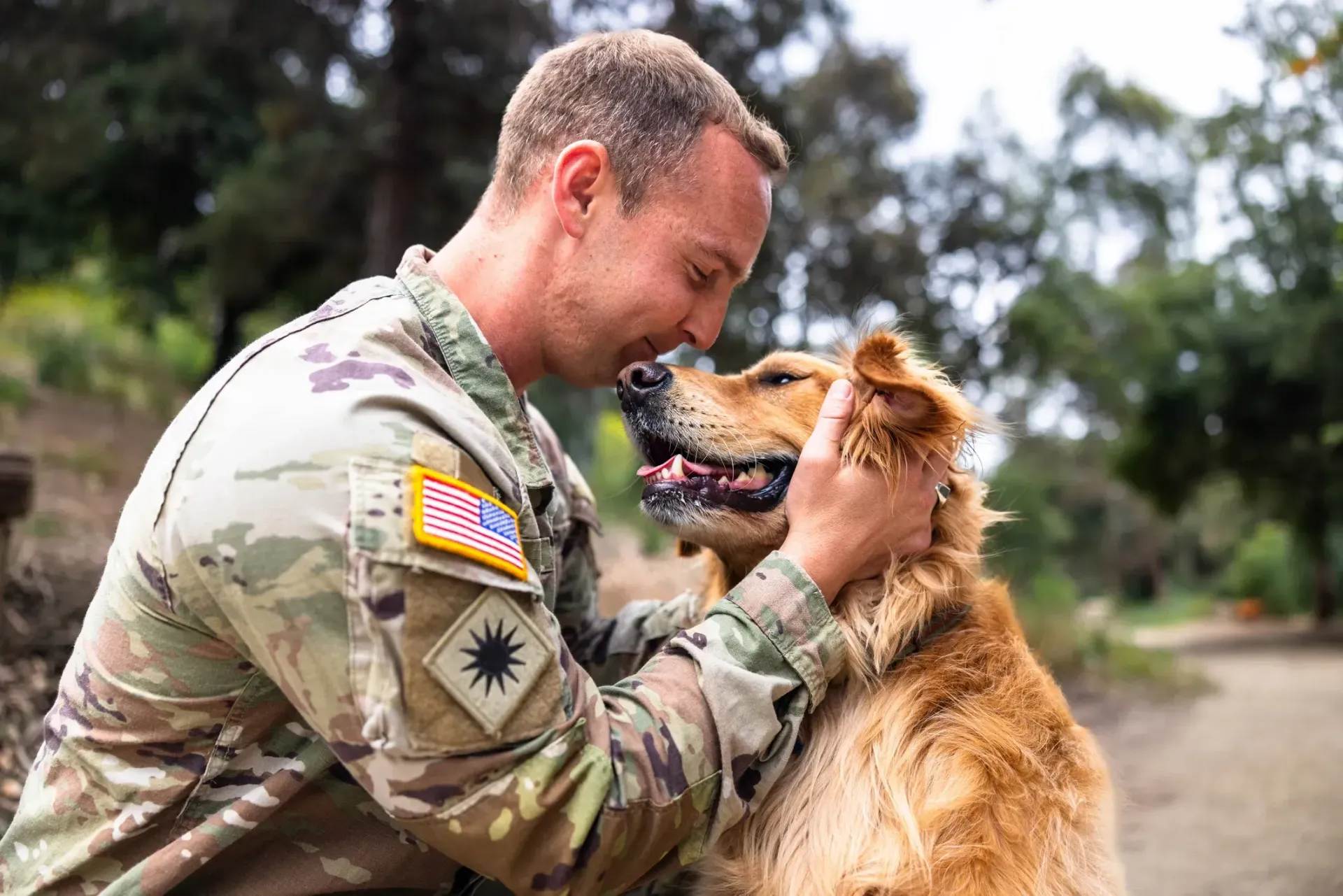 A group of men are standing around looking at a tablet.