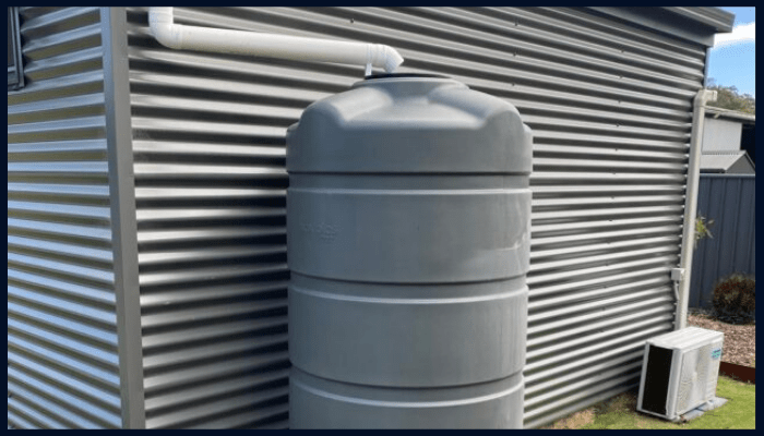 ACT-compliant rainwater tank setup with diverter, overflow, pump, and mosquito-proof inlet