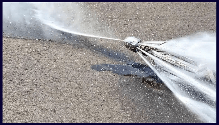 High-pressure hydro jetting nozzle clearing blocked drains in Canberra
