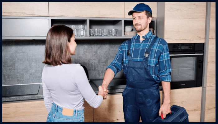 plumber with homeowner handshake