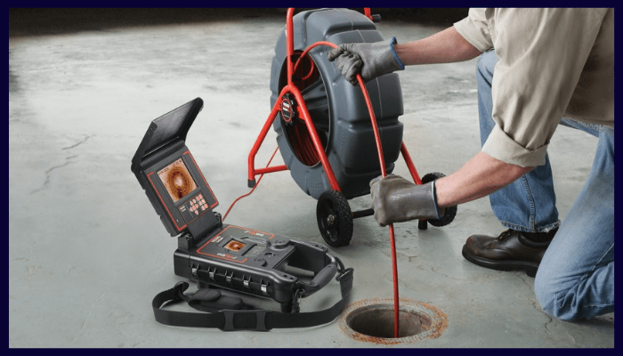 Licensed plumber using CCTV camera for preventive drain inspection in Canberra
