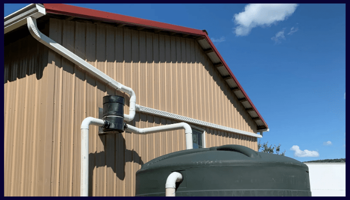 rainwater tank connected to a gutter and downpipe system