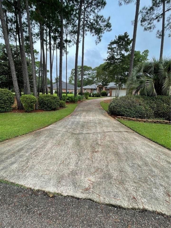 A before and after photo of a concrete driveway in Roseville