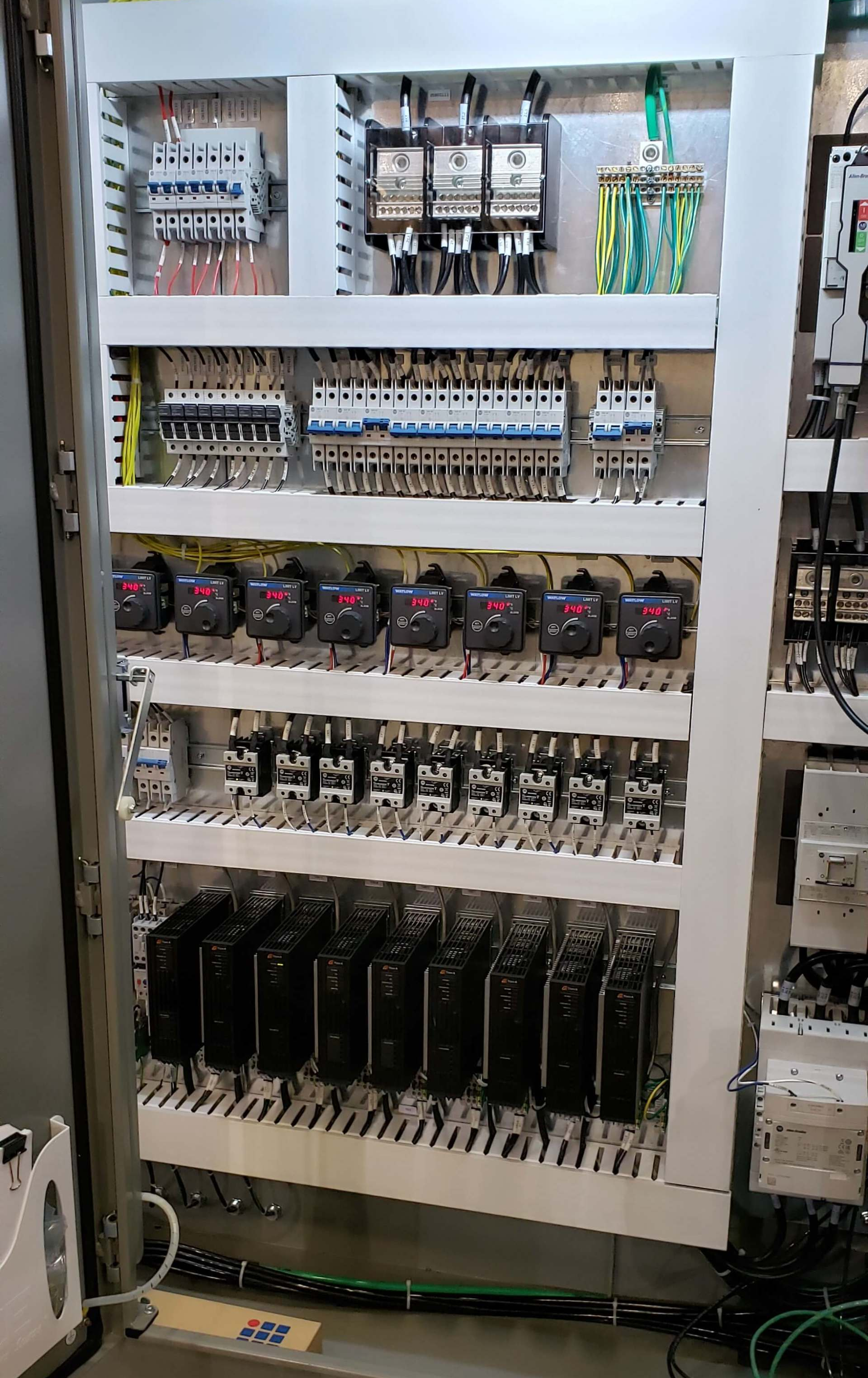 A controls box with neatly organized rack mounted components.
