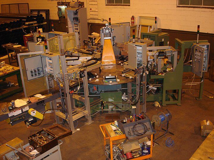A jumble of complicated machinery around a central table.