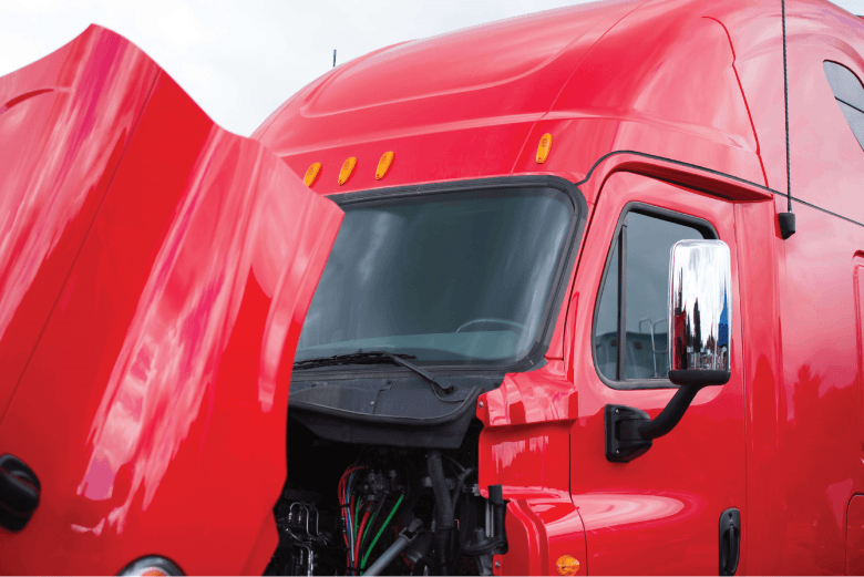 A front view of a red semi truck with its hood open