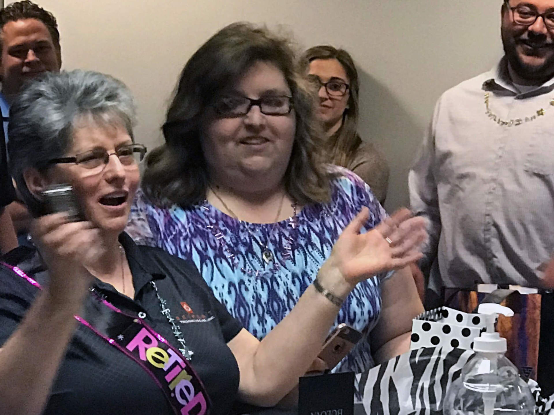 Grazyna surrounded by other employees