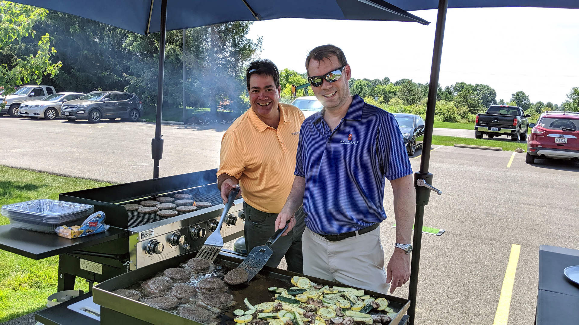Two employees at the grill