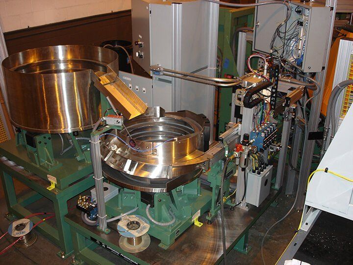 A large piece of manufacturing equipment with two large metal vessels.