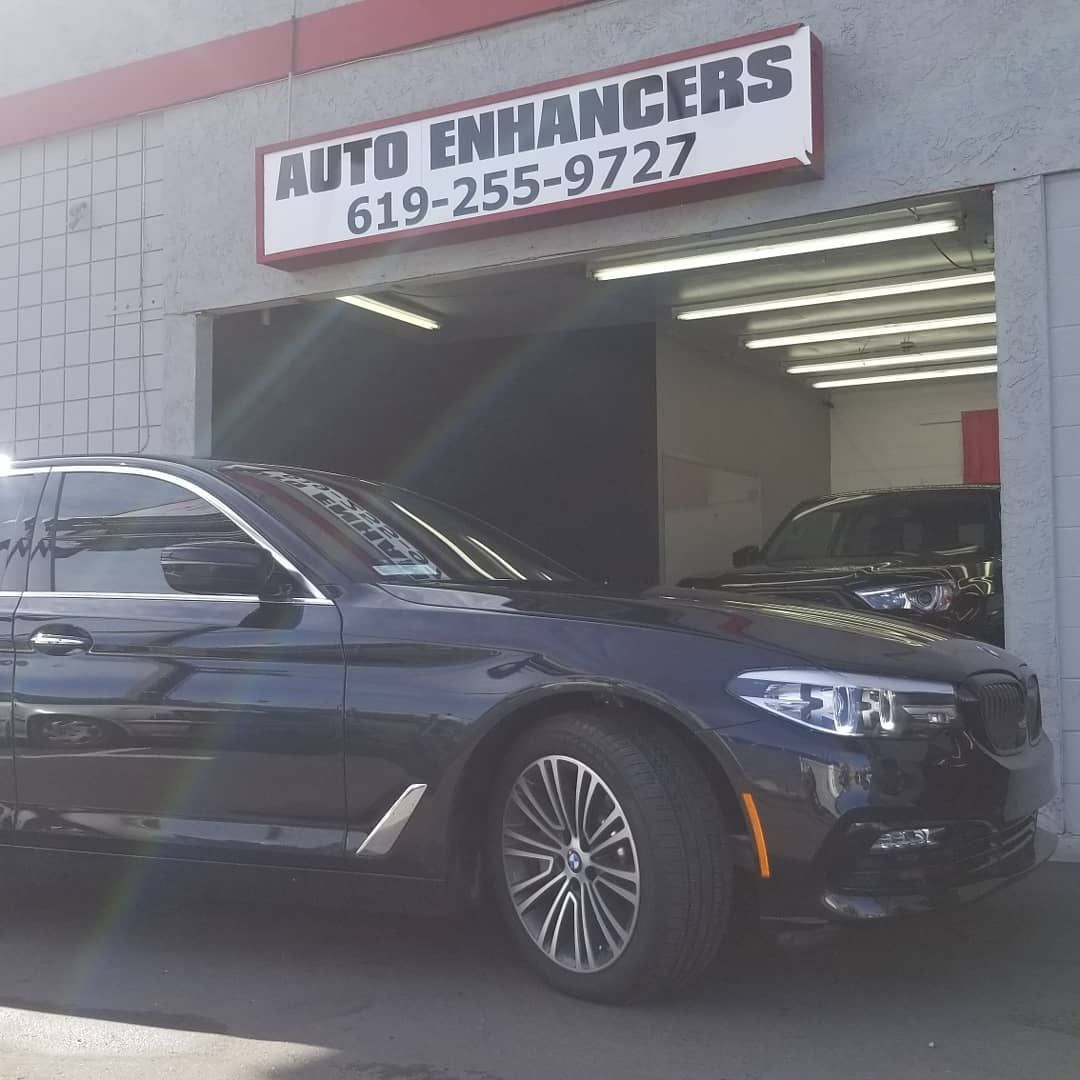 A black car parked in front of 