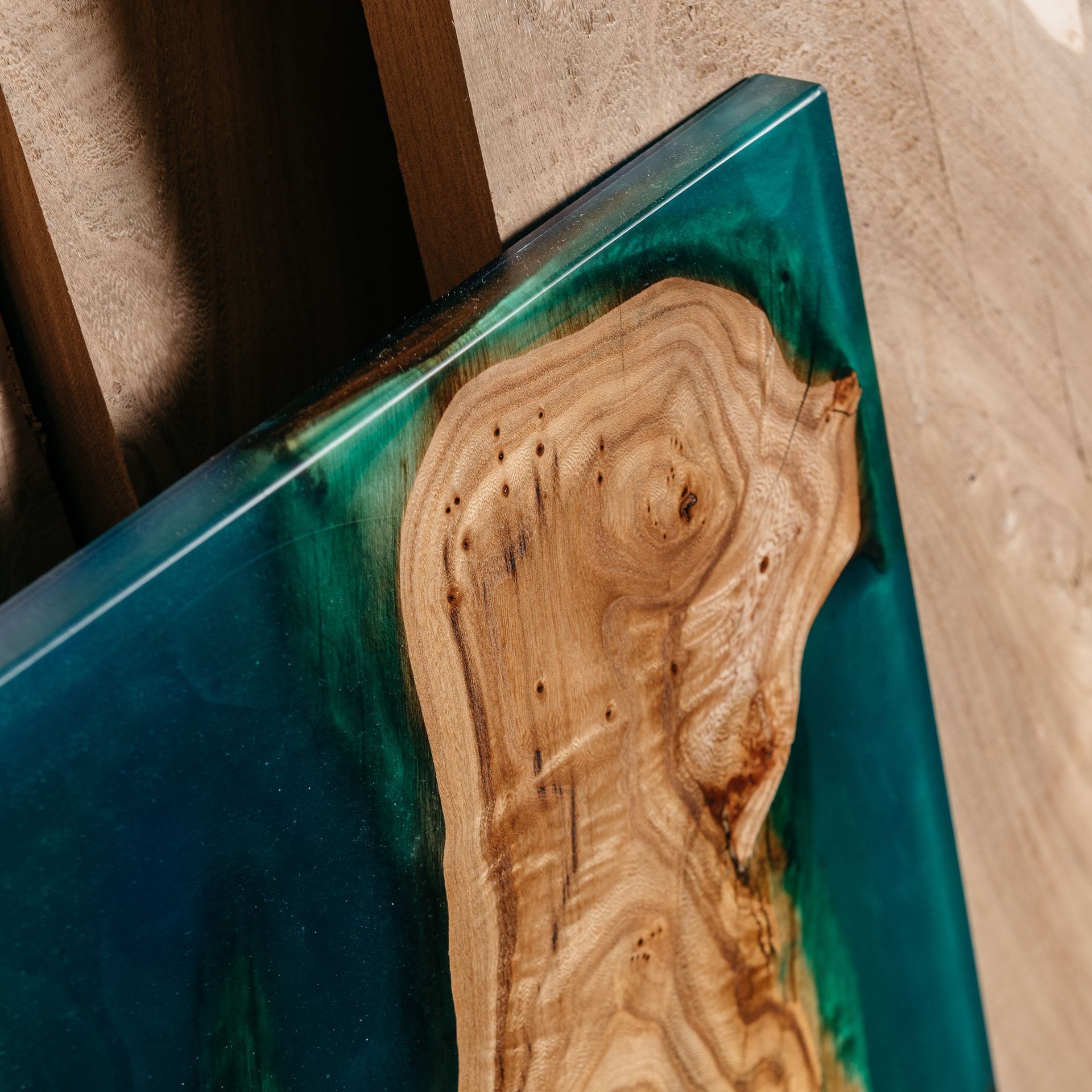 A close up of a piece of wood with resin on it.