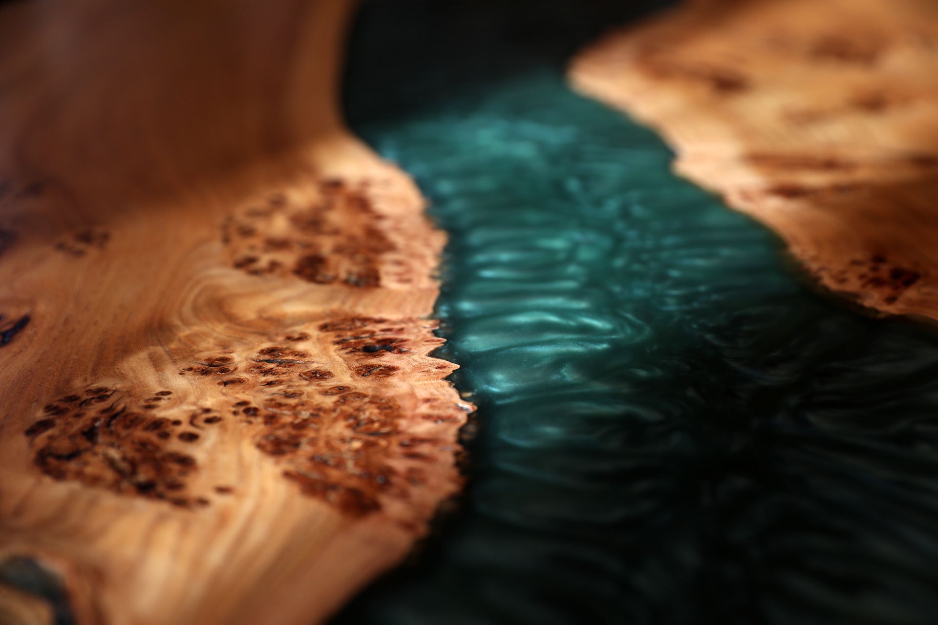 A close up of a piece of wood with a green background.
