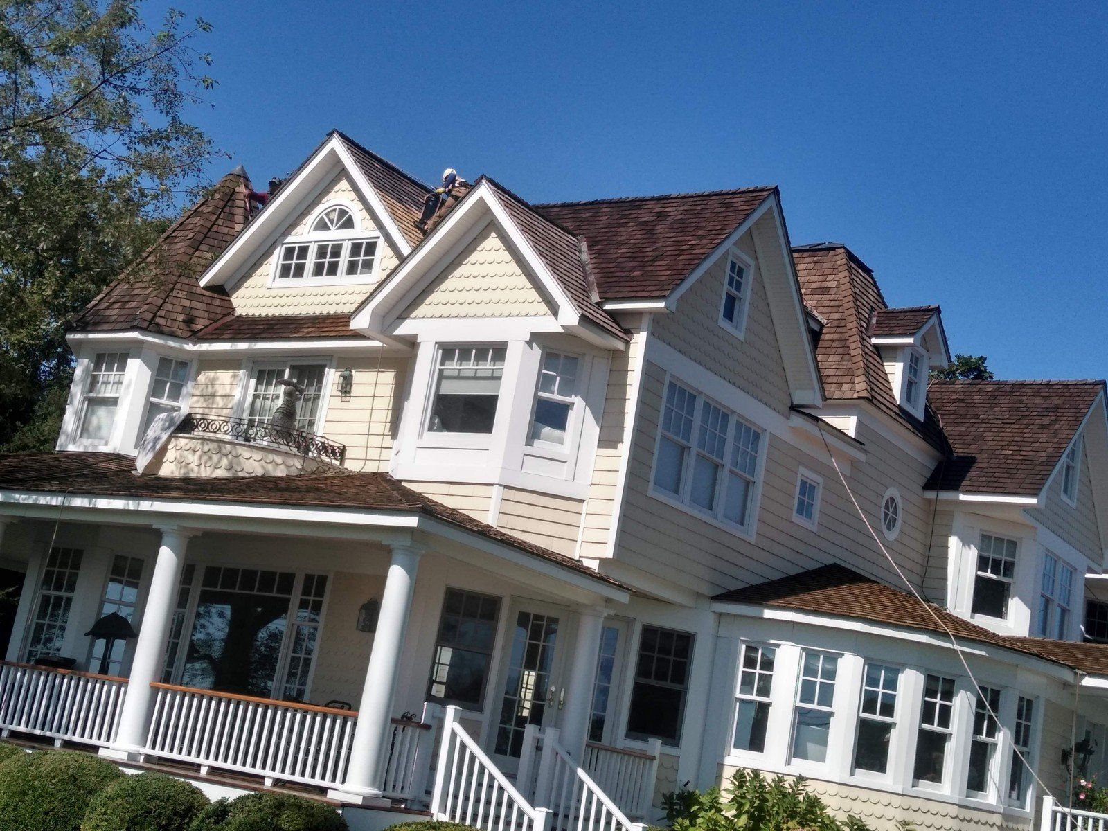 Worker on roof top repairing